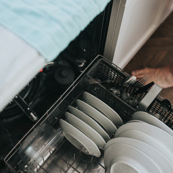 Dishwasher rack loaded with clean plates