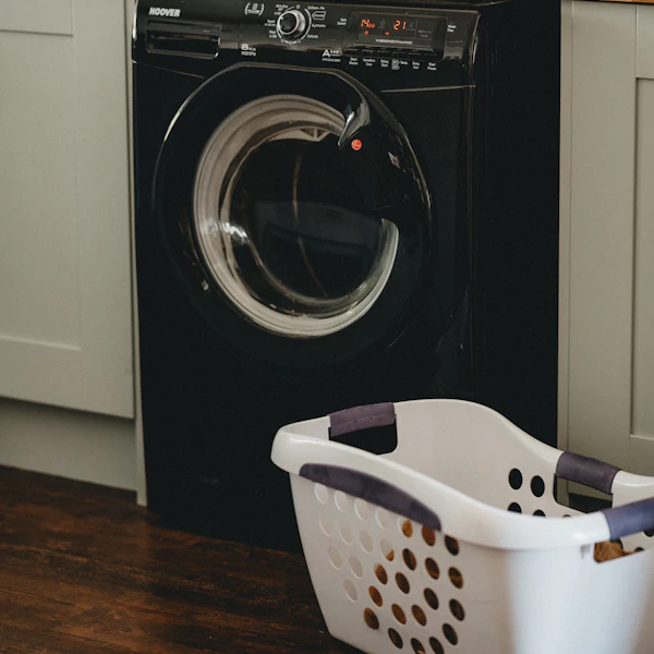 Black front-load dryer with laundry basket