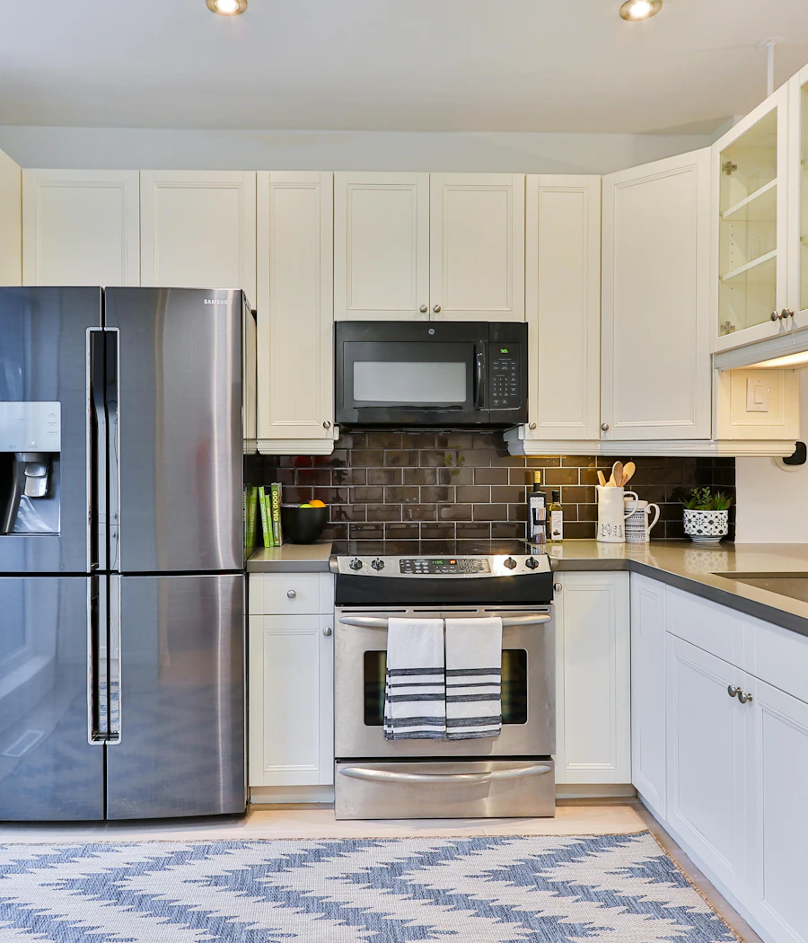 Stainless steel French door refrigerator in a bright kitchen