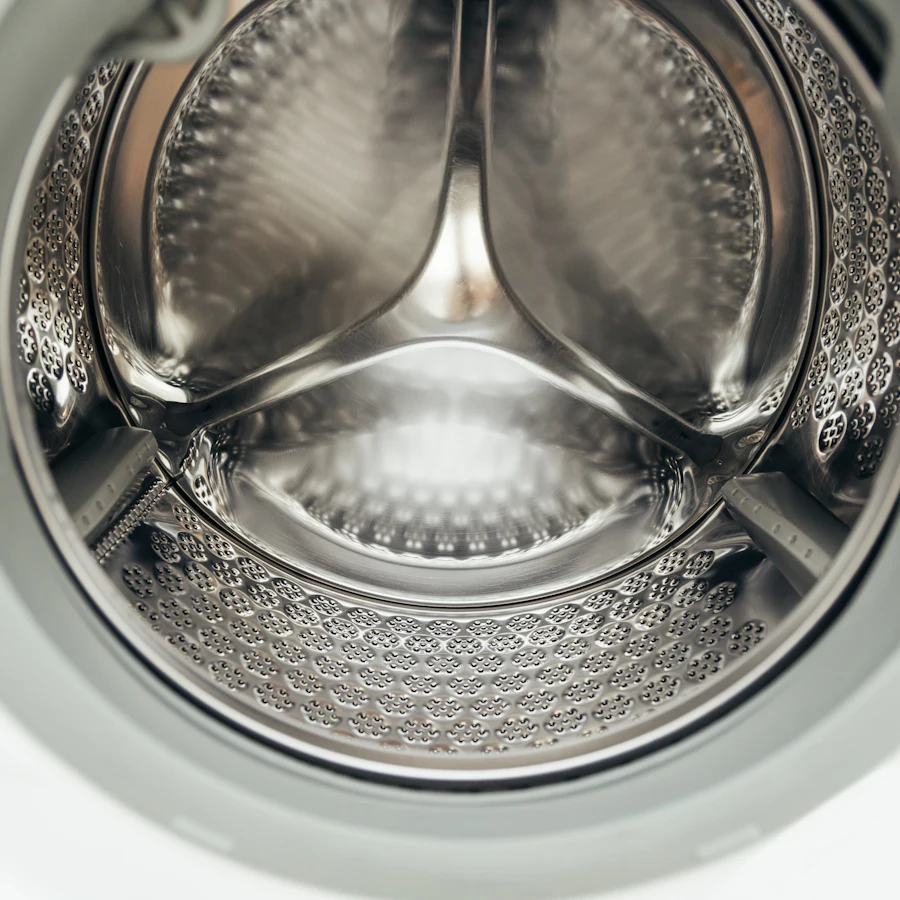 Inside a stainless steel washing machine drum